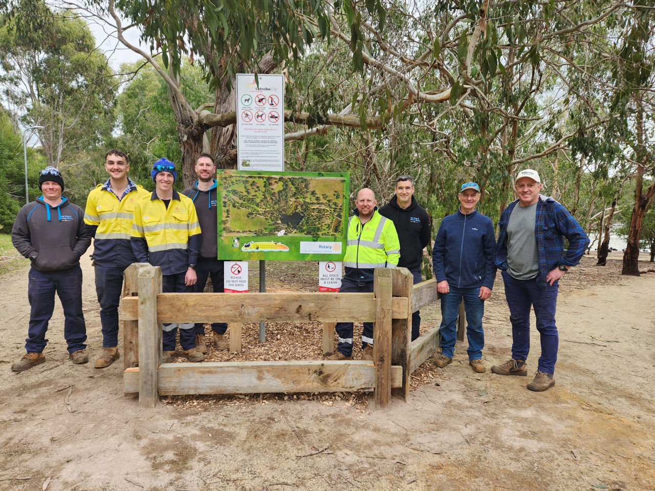 Loy Yang B maintenance workers with Traralgon Railway Reservoir Conservation Reserve secretary John Langstaff at a volunteer day.