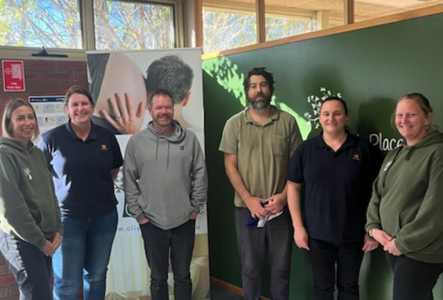 The Loy Yang B Finance team pictured with Olivia’s Place Volunteer Coordinator Silvia Licheri (left) and Material Aid Coordinator Junelle Wilson (right) during a volunteer day at the organisation. 