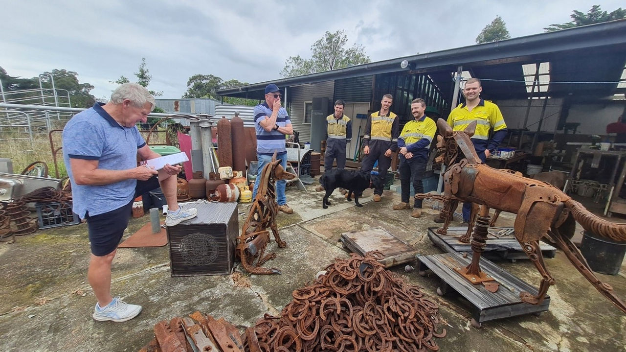 Apprentices Toby Downes, Oscar Smith, Liam French and Mitch Russell collaborate with David Gellion and Rob Burns from the Gippsland Plains Rail Trail Committee of Management.