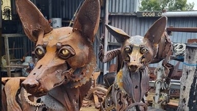 A close up of the dog sculpture.